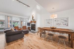 a living room with a couch and a table at Unit 31 - 5 bedrooms, 8 people in Beaupré