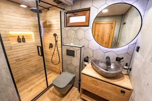 a bathroom with a sink and a mirror at Вила Бучала Villa Buchala in Dyakovo +41 photos