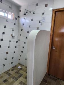 a bathroom with a toilet and a door at Roof Garden 3 in Coatepec +32 photos