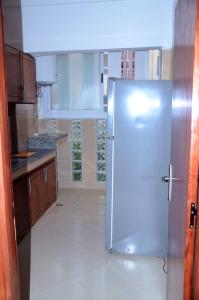 a kitchen with a stainless steel refrigerator in it at إقامة جنان فاس in Fez