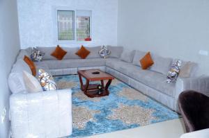 a living room with a couch and a table at إقامة جنان فاس in Fez +2 photos
