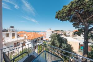 a balcony with a view of a city at Socratous Apartments in Mytilene
