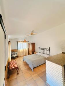 a bedroom with a bed in the middle of a room at Villa Mediterraneo Rooms Piscina jardin parking in Blanes +31 photos