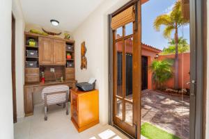 a home office with a desk and a sliding glass door at Stunning home - Amazing Mountain Views in Loreto