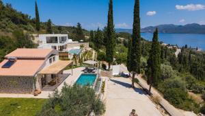 an aerial view of a house with a swimming pool at Villa Magganas in Nikiana