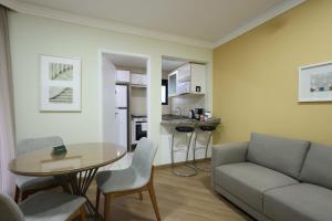 a living room with a couch and a table at Transamerica Paradise Garden in São Paulo
