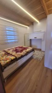 a bedroom with a bed in a room at Hacel's Stairs in Ordu
