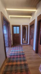 an empty hallway with a rug on the floor at Hacel's Stairs in Ordu +11 photos