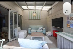 a living room with a couch and a table at Skulpie in Cape Town