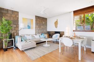 a living room with a couch and a table at Villa Aster in Coti-Chiavari