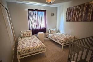 a room with two beds and a window at Glen Eagles King Nook in Colorado Springs