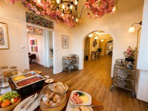 a kitchen with a buffet of food on a table at Happy Sintra Inn Guesthouse & Breakfast in Sintra