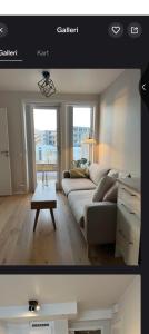 ein Wohnzimmer mit Sofa und Tisch in der Unterkunft Torleiv in Oslo