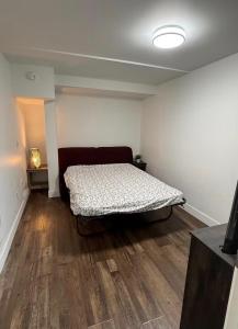 a bedroom with a bed in the middle of a room at Victoria BNB in Victoria