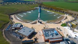 an aerial view of a body of water at Lost Shore Surf Resort in Ratho
