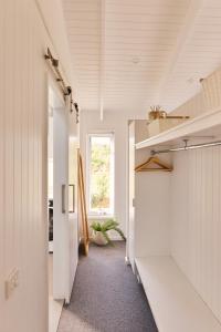 a hallway of a house with white walls at Drift, Port Campbell in Port Campbell