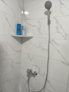 a shower with a shower head in a bathroom at Tulipan LUX in Doboj +16 photos