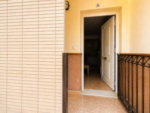 an open door to a hallway in a building at Punta Umbria Apartment in Punta Umbría