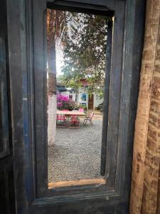 a mirror view of a patio with a table at Estrela Praia in Fernando de Noronha +56 photos