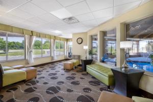 a living room with a couch and a table at Best Western Geneseo Inn in Geneseo