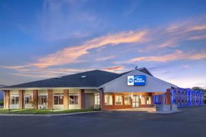 a building with a sign on the front of it at Best Western Geneseo Inn in Geneseo