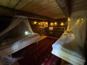 a bedroom with two beds in a attic at Kolin Mattila B&B in Kolinkylä +79 photos