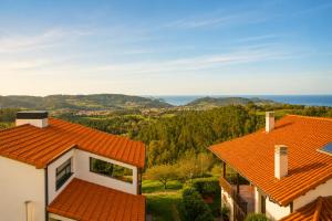 a view of a house with an orange roof at La Cepada in Carrandi