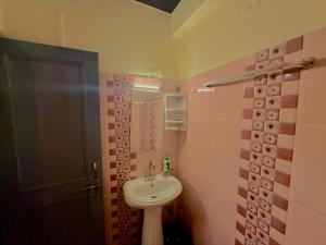 a bathroom with a sink and a shower at Friends By Alizeh 2 0 Mcleodganj in Dharamshala +34 photos