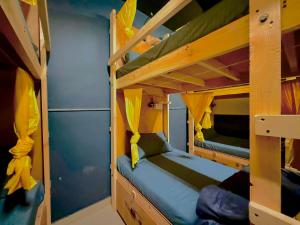 a bunk bed room with two bunk beds in it at Friends By Alizeh 2 0 Mcleodganj in Dharamshala