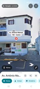 a screenshot of a building with a sign on it at Ground floor apartment steps from the Cathedral in Santo Ângelo
