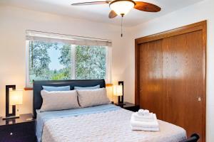 a bedroom with a bed and a window at Copperopolis Home - Lake Access & Mtn Views in Copperopolis