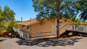 a house with a staircase and a tree at Copperopolis Home - Lake Access & Mtn Views in Copperopolis +48 photos