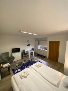 a hotel room with a bed and a desk at Apartmán Hollého 2 in Trenčín
