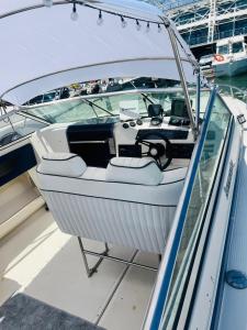 a boat is docked in a dock on the water at VINA ROMANCE - Romantic Boat Stay in Lisbon Marina in Lisbon +38 photos