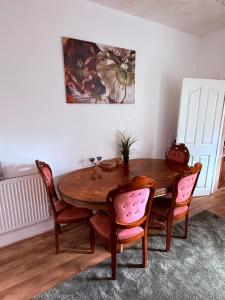 a dining room table and chairs in a room at Dream easy in Birmingham