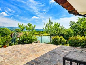 a patio with a view of a lake at La Fontanella in Montecchia di Crosara