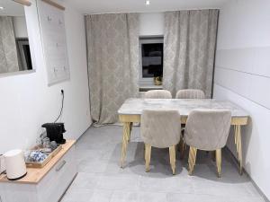 a dining room with a table and chairs at Eliasar2 in Linz