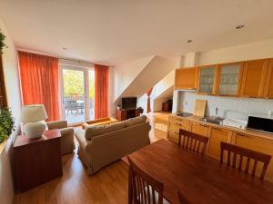 a living room with a couch and a table at Moravian Garden House Novosedly Adults Only in Novosedly +27 photos