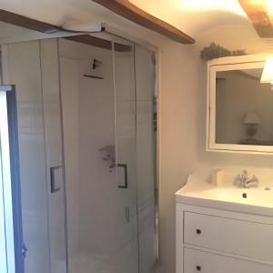 a bathroom with a shower and a sink at Casita del Castillo Mora de Rubielos in Mora de Rubielos