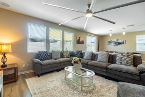 a living room with a couch and a table at Temecula Valley 4BR - Pool Table & Fenced Yard in Winchester