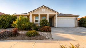 a house with a driveway and a garage at Temecula Valley 4BR - Pool Table & Fenced Yard in Winchester +32 photos