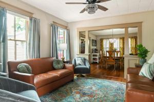 a living room with a couch and a table at Casa Del Sol Historic St Aug Hideaway in St. Augustine