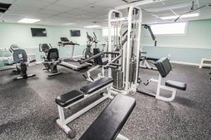 a gym with several tread machines in a room at Holly Tree Resort - Studio in Yarmouth +7 photos