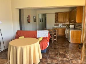 a living room with a couch and a table at Apartamentos Esencia vistas al embalse 2 in Hornos