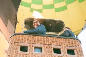 a man is in a hot air balloon at Luxor hot air balloon co in Jazīrat al ‘Awwāmīyah