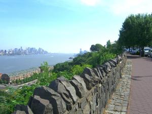 a stone wall with a view of the city at Perfect Studio with AC near NYC in West New York +3 photos