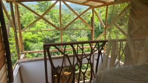 a view from a room with a window at Reserva Wanaka, San Carlos in Cocorná