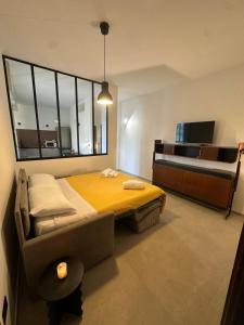 a bedroom with a bed and a large window at Amena Sea & City in Brindisi