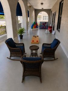 a waiting area with chairs and a table in a building at The Linda Grande Hotel in Ocean City