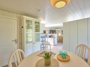 a kitchen and dining room with a table and chairs at Barri in Zutendaal +23 photos